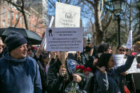 <p>A mourner walks in a procession carrying a sign for Steve Bannon around Washington Square Park during the “Mock Funeral for Presidents’ Day” rally in New York City on Feb. 18, 2017. (Gordon Donovan/Yahoo News) </p>