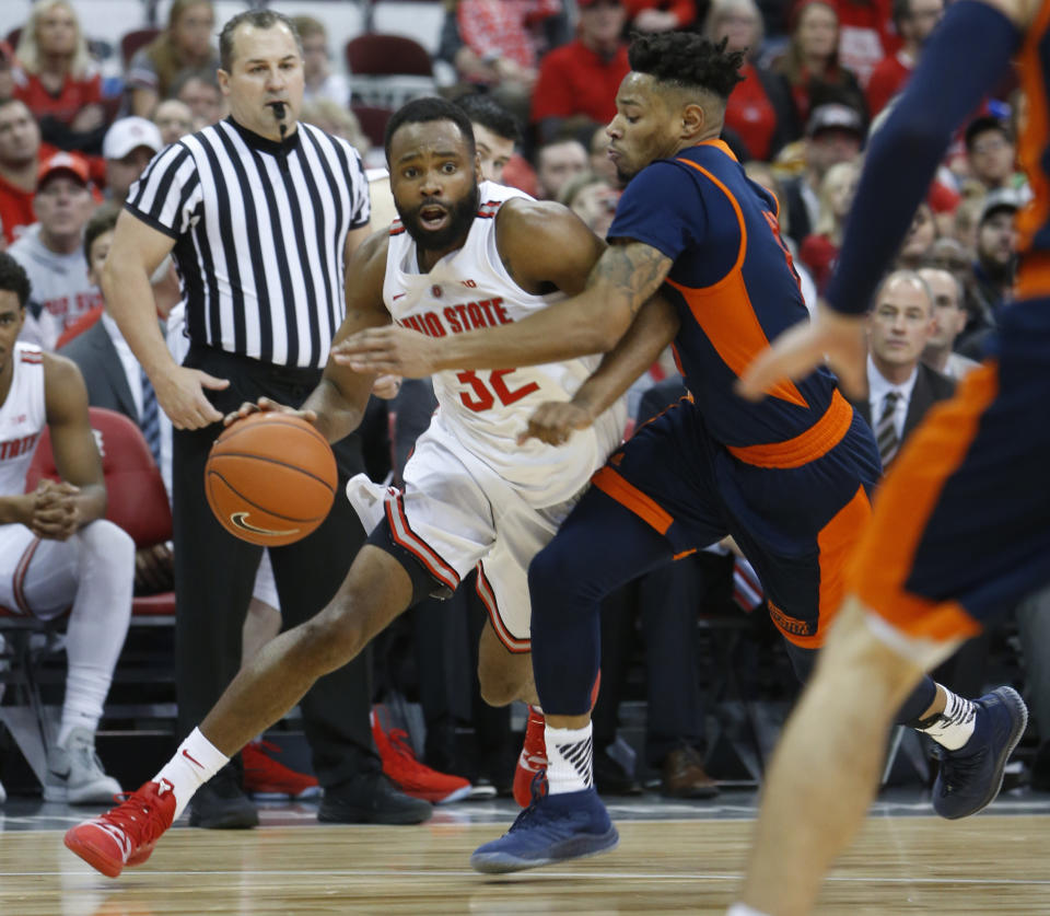 Ohio State's Keyshawn Woods, left, drives to the basket against Bucknell's Avi Toomer during the second half of an NCAA college basketball game Saturday, Dec. 15, 2018, in Columbus, Ohio. Ohio State beat Bucknell 73-71. (AP Photo/Jay LaPrete)