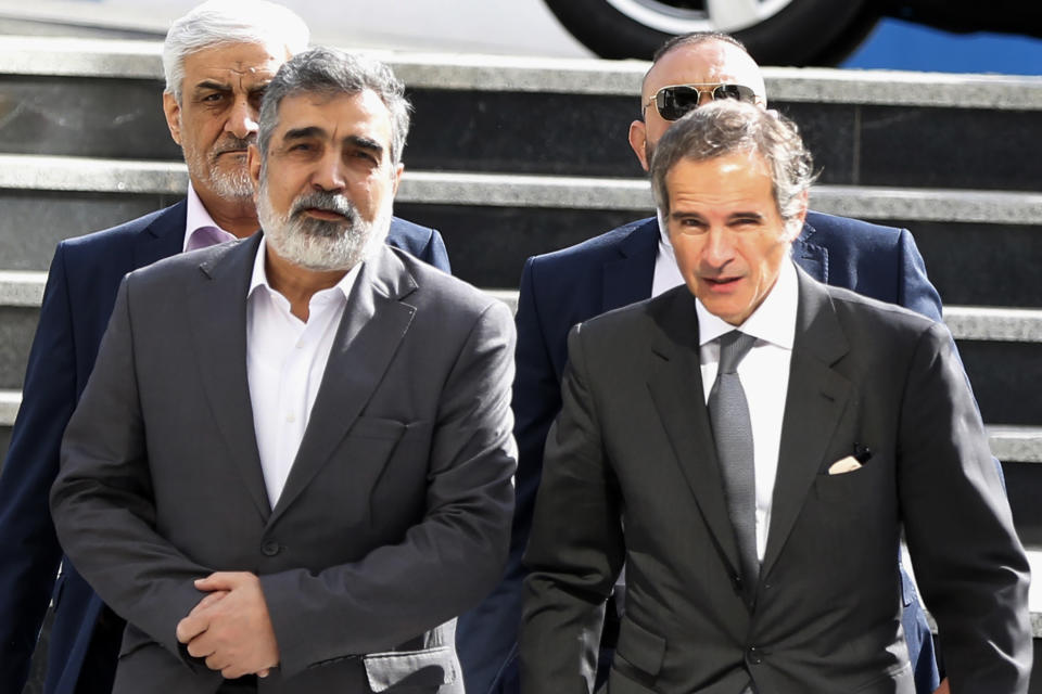 International Atomic Energy Organization, IAEA, Director General Rafael Mariano Grossi, right, arrives for a meeting with head of Atomic Energy Organization of Iran Mohammad Eslami as he is welcomed by the spokesman for Iran's atomic agency Behrouz Kamalvandi in Tehran, Saturday, March 4, 2023. (AP Photo/Vahid Salemi)