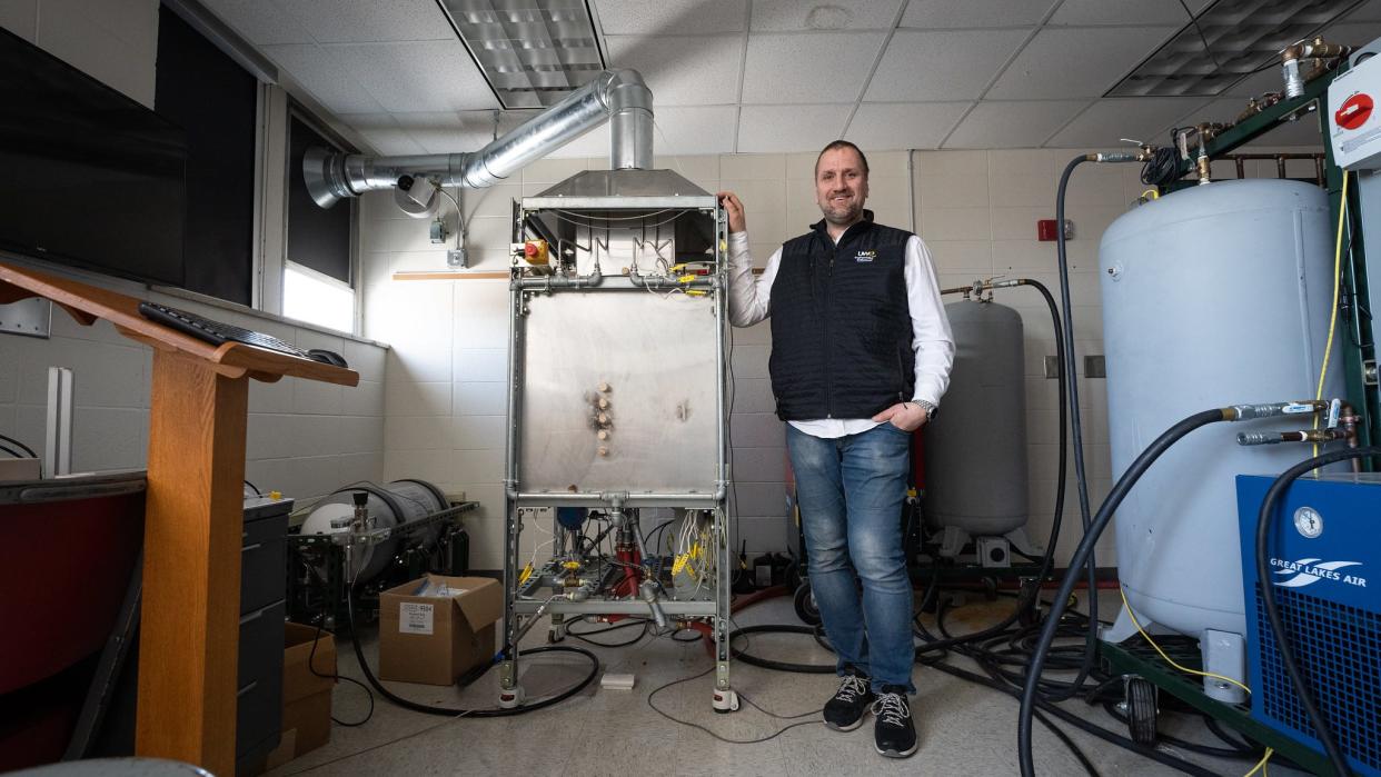 Prototype of the flameless impingement oven built by Pawel Olszewski stands next to a prototype of the flameless impingement oven he built in the engineering and engineering technology department. The oven mixes air and flammable gas in such a way that it creates heat without visible flame.