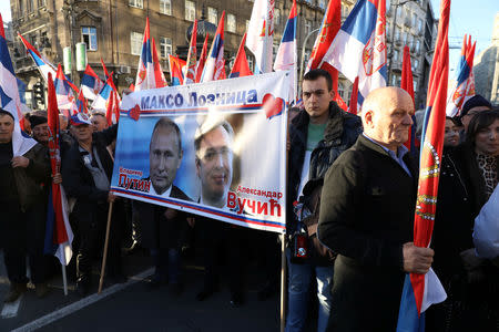 People display Serbian flags during the visit of Russian President Vladimir Putin in Belgrade, Serbia, January 17, 2019. REUTERS/Kevin Coombs