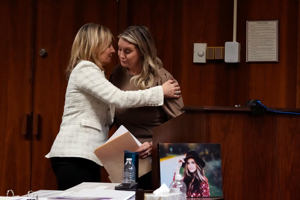 Oakland County prosecutor Karen McDonald hugs Nicole Beausoleil, mother of Madisyn Baldwin, after Nicole's victim impact statement, Friday, Dec. 8, 2023, in Pontiac, Mich. Parents of students killed at Michigan's Oxford High School described the anguish of losing their children Friday as a judge considered whether Ethan Crumbley, a teenager, will serve a life sentence for a mass shooting in 2021.