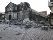 The St. Catherine church is damaged after an earthquake struck Porac town, Pampanga province, northern Philippines Monday, April 22, 2019. A strong 6.1 magnitude earthquake in the north Philippines on Monday trapped some people in a collapsed building, damaged an airport terminal and knocked out power in at least one province, officials said. (AP Photo/Vhic Y Naluz)