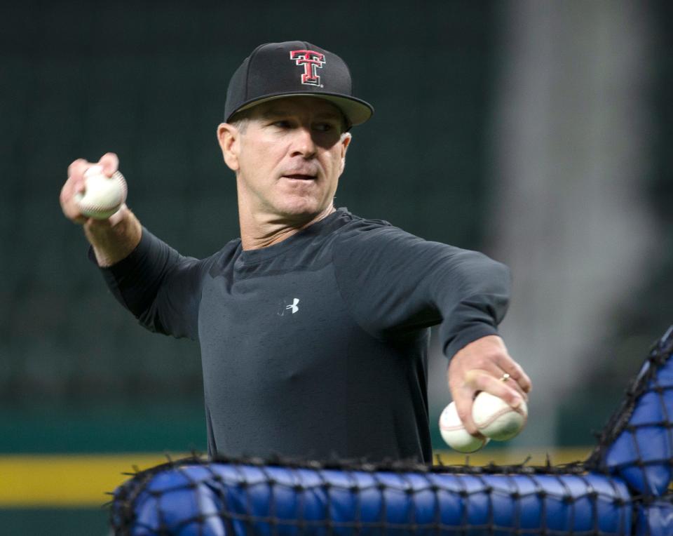 Texas Tech's head baseball coach Tim Tadlock throws the ball during practice ahead of the team's Big 12 tournament game against Kansas State, Tuesday, May 24, 2022, at Globe Life Field in Arlington.