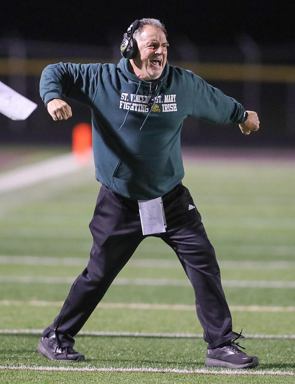 St. Vincent-St. Mary head coach Terry Cistone reacts after a first quarter touchdown against Walsh Jesuit on Friday, Oct. 21, 2022 in Cuyahoga Falls.