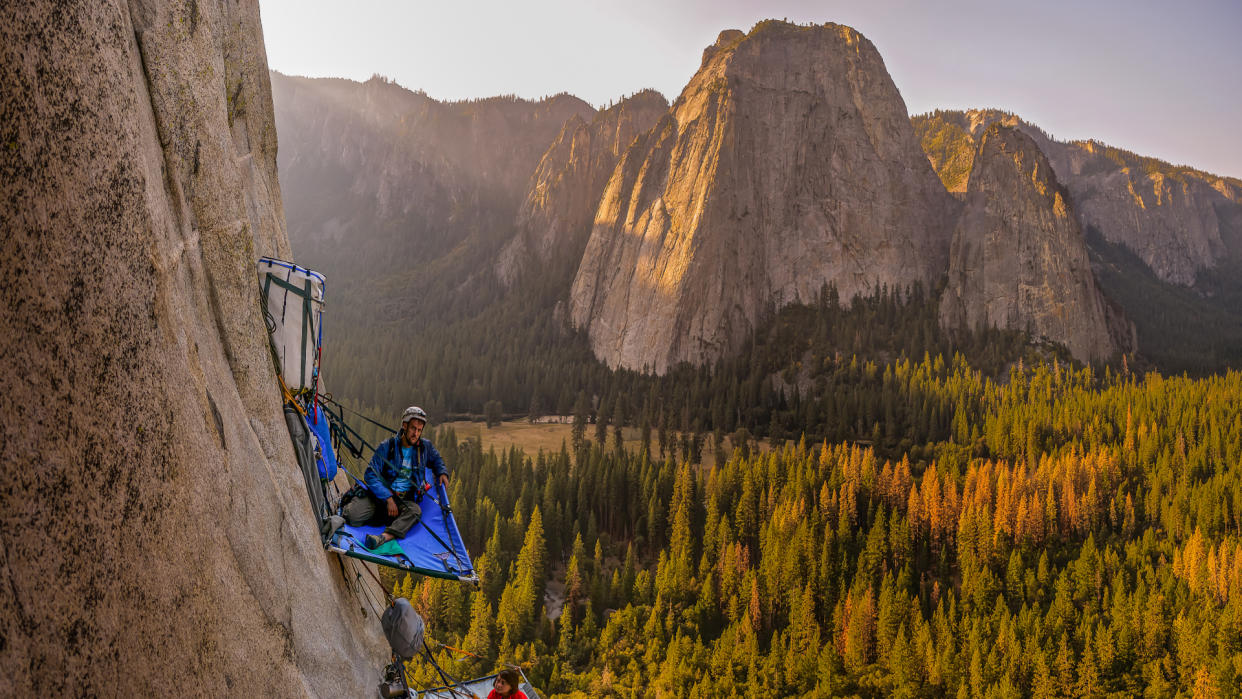  Two rock climbers on portaledges on triple direct, El Capitan. 