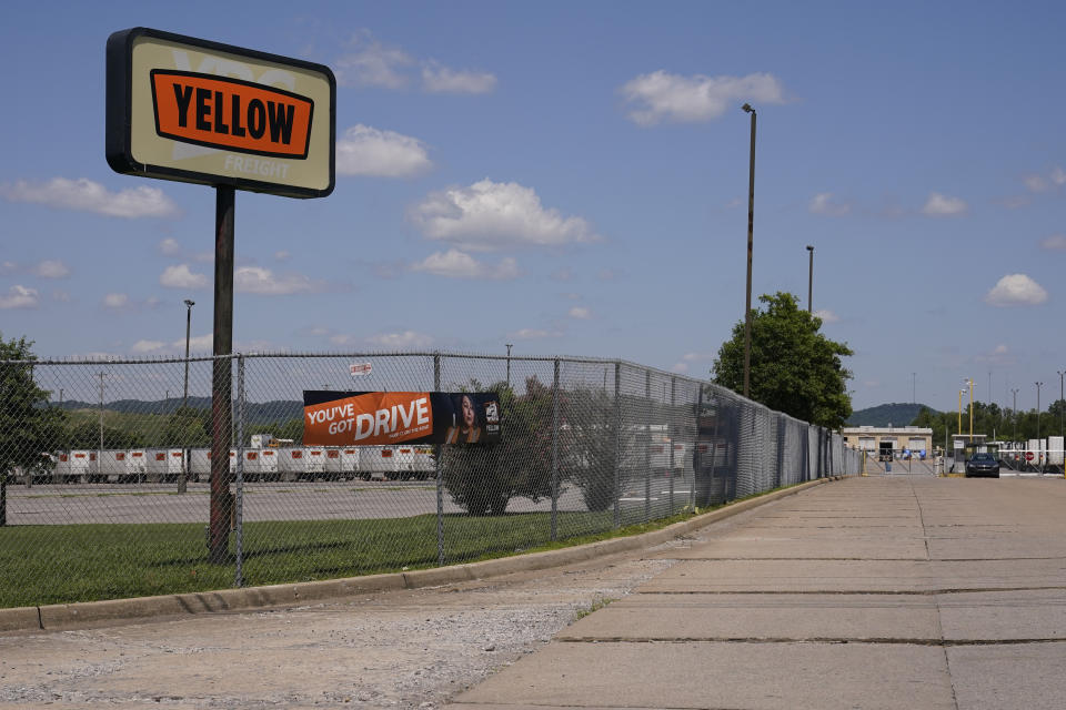 A sign for Yellow Corp. trucking company stands outside its facility Monday, July 31, 2023 in Nashville, Tenn. The troubled trucking company is shutting down and filing for bankruptcy, the Teamsters said Monday. An official bankruptcy filing is expected any day for Yellow, after years of financial struggles and growing debt. (AP Photo/George Walker IV)