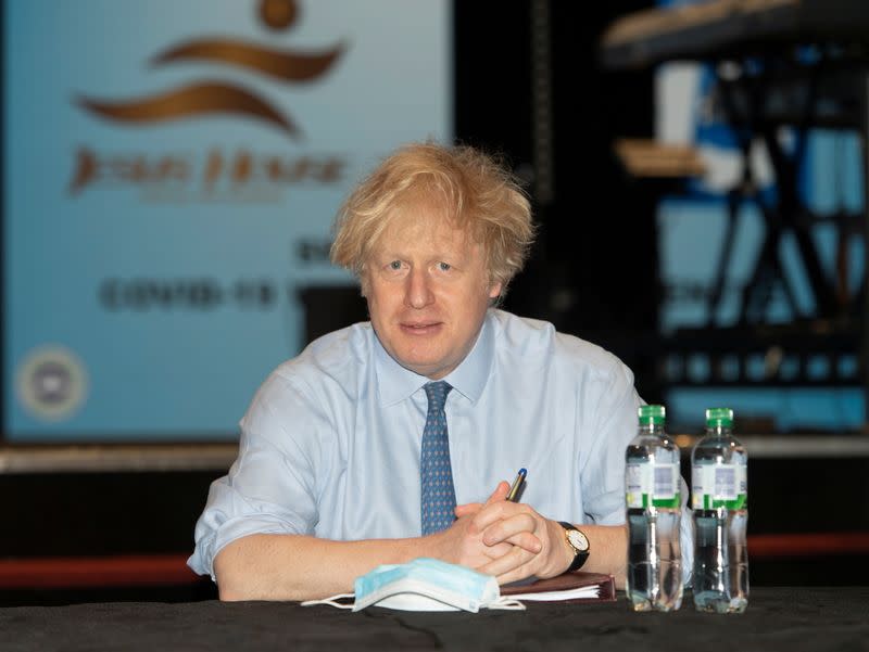 Britain's Prime Minister Boris Johnson visits a COVID-19 vaccination centre, in London