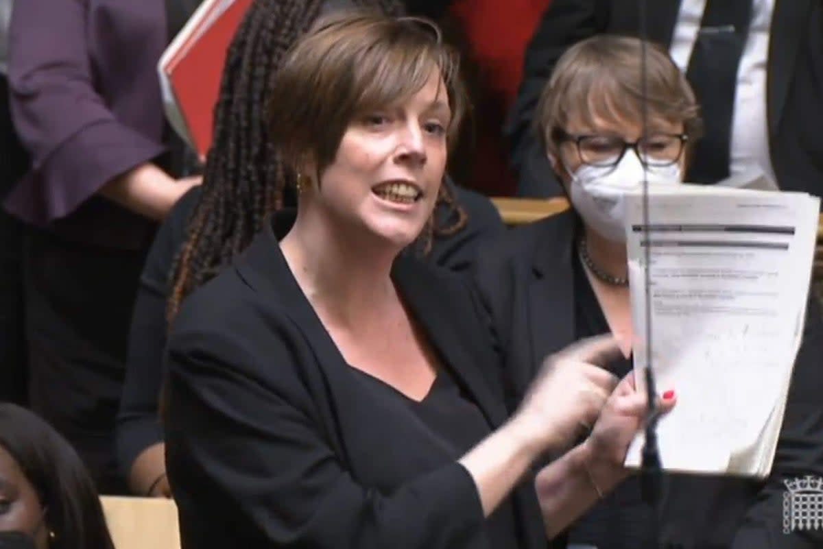 Jess Phillips MP holds the Sue Gray report up as she responds to a statement by Prime Minister Boris Johnson to MPs in the House of Commons on the Sue Gray report (PA Archive)