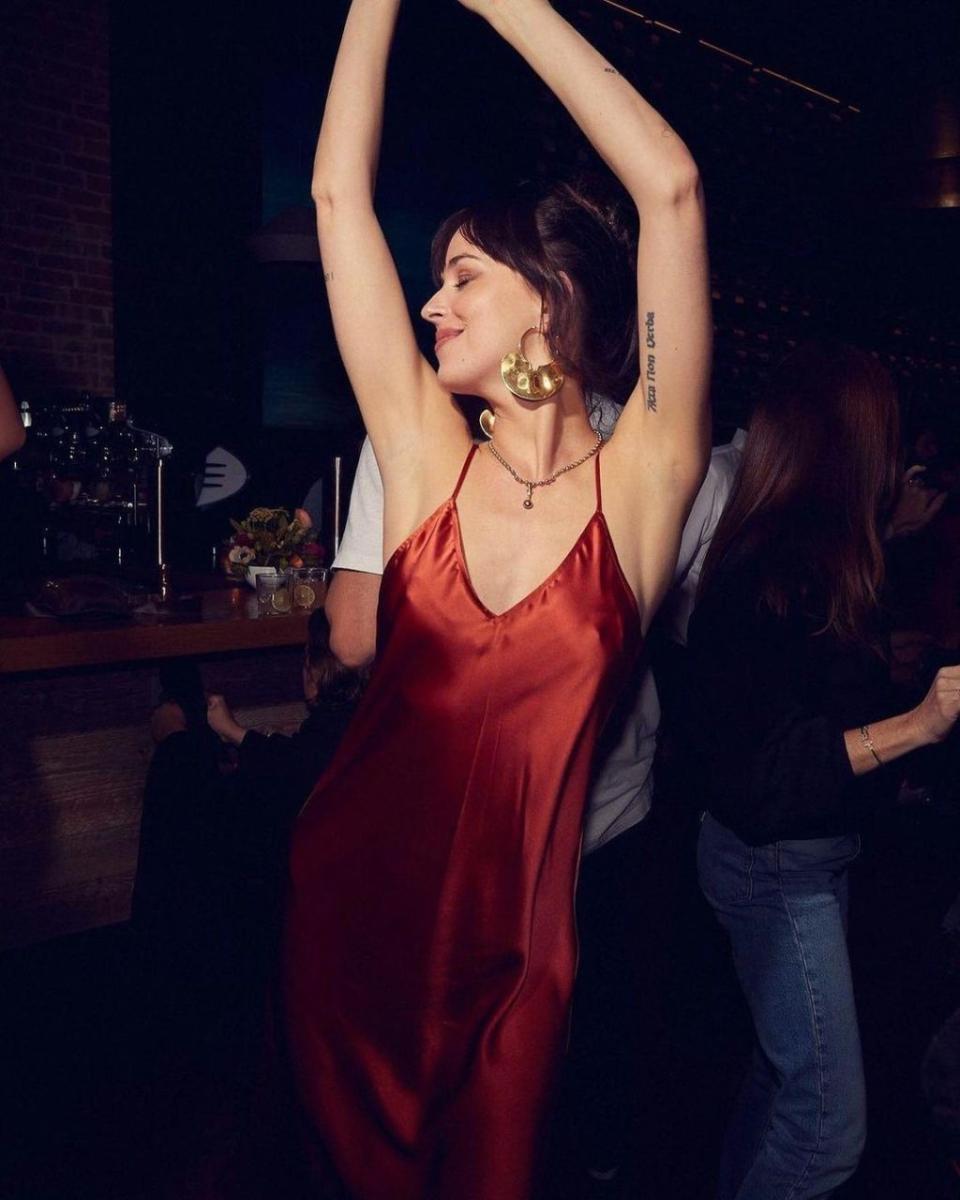 Dakota Johnson dancing at a Netflix party at the 2021 Telluride film festival.