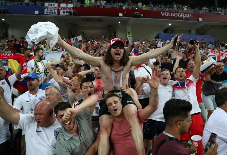 Fans celebrate England's win (REUTERS)