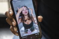 Mia Hall, 14, watches Katie Fang GRWM videos on Tik Tok on Thursday, Aug. 29, 2024, in Bronx borough of New York. (AP Photo/Brittainy Newman)