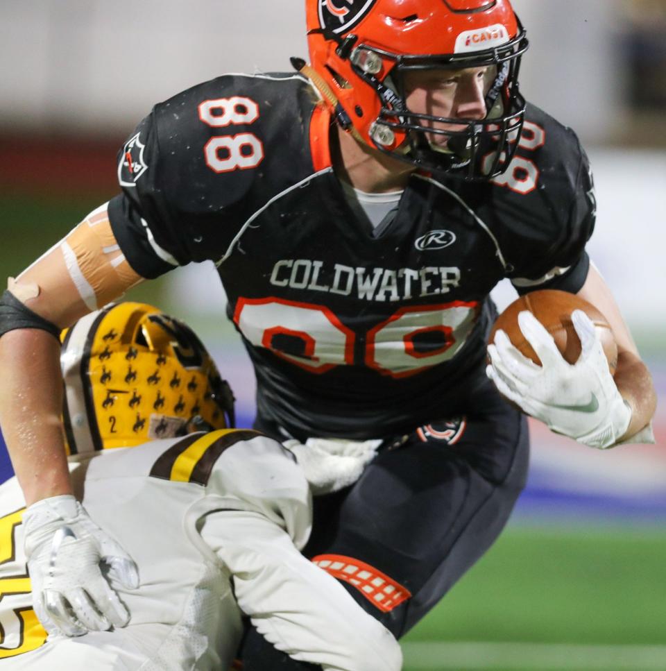 Coldwater's Jesse Meyer is tackled by West Jefferson's Adam Fry during a Division VI state semifinal Nov. 27 at Piqua.