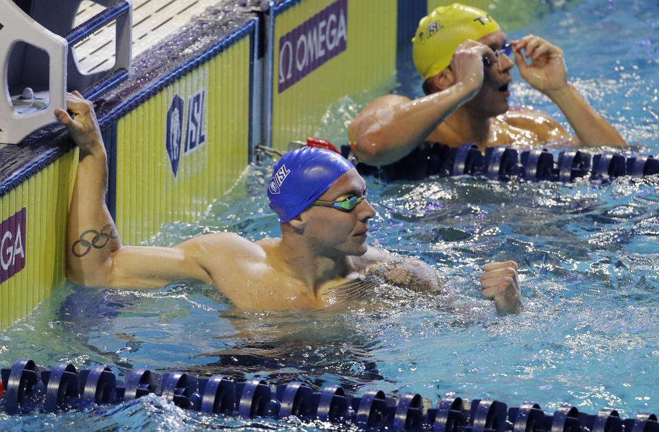 Caeleb Dressel celebrates after his swim in the men's 100-meter butterfly during an International Swimming League event Friday, Dec. 20, 2019, in Las Vegas. (AP Photo/John Locher)