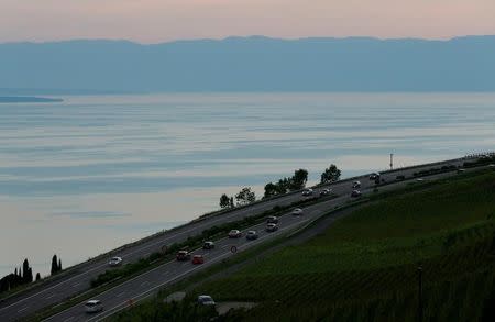FILE PHOTO: Vehicles are seen on the A9 motorway overlooking Lake Leman in Chardonne near Vevey, Switzerland May 28, 2017. REUTERS/Denis Balibouse