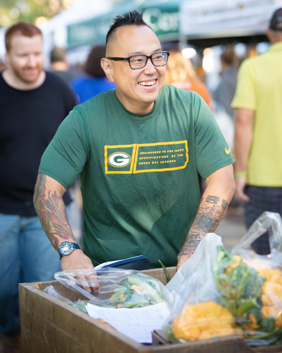 Tory Miller, who runs L’Etoile in Madison, is shown at the Dane County Farmers Market. He won the James Beard award for best chef in the Midwest in 2012.