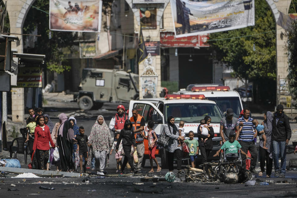 Residents of the Jenin refugee camp fled their homes as the Israeli military pressed ahead with an operation in the area on Tuesday, July 4, 2023. Palestinian health officials put the death toll from the two-day raid at 10. The Israeli military said Israel launched the operation because some 50 attacks emanated over the past year from Jenin. (AP Photo/Majdi Mohammed)