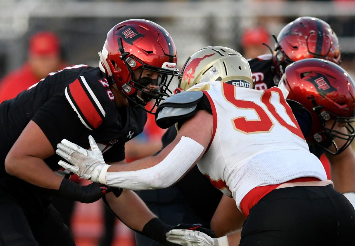 Lubbock-Cooper's Holton Hendrix, left, blocks Coronado's Chad Williams, Friday, Sept. 30, 2022, at Pirate Stadium in Woodrow. Lubbock-Cooper won, 15-14.