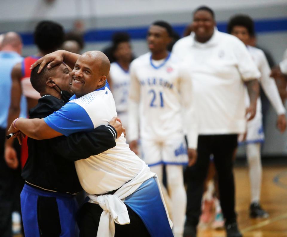 The Overton Wolverines head coach Shelvie Rose celebrates a win against the Bartlett Panthers on Feb. 25, 2023, in the region 8-4A quarterfinals at Overton High School in Memphis.