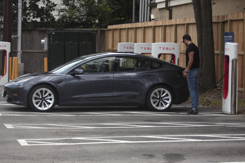 A Tesla supercharging location is seen on Kipling Street, June 3, 2024 in Houston. Charging stations have been hit particularly hard by thieves who likely want to sell the highly conductive copper wiring inside the cables at near-record prices. But authorities and charging company officials say similar thefts are increasing across the U.S. as more charging stations are built. (AP Photo/Lekan Oyekanmi)