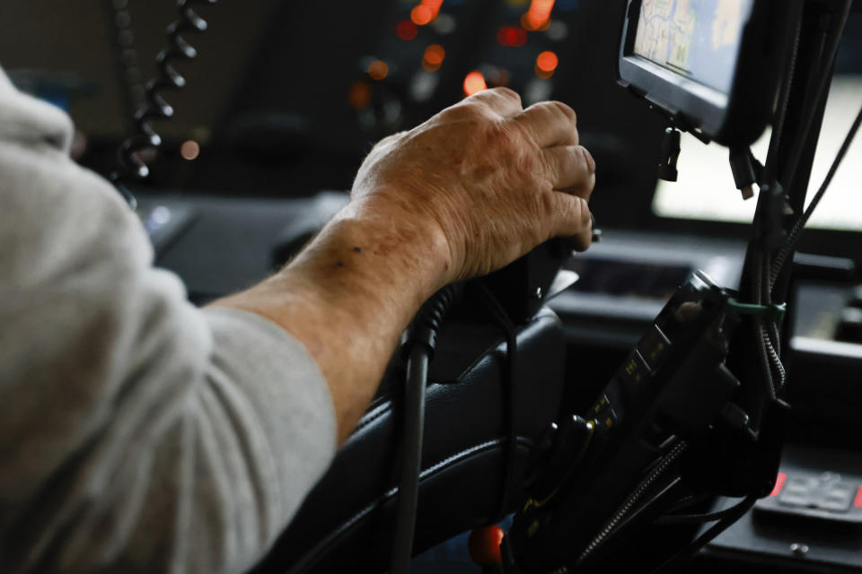 Army Corps of Engineers Small Craft Captain Robert Kilchenstein navigates USACE Catlett towards the collapsed Francis Scott Key Bridge, Wednesday, April 3, 2024, in Baltimore. (AP Photo/Julia Nikhinson)