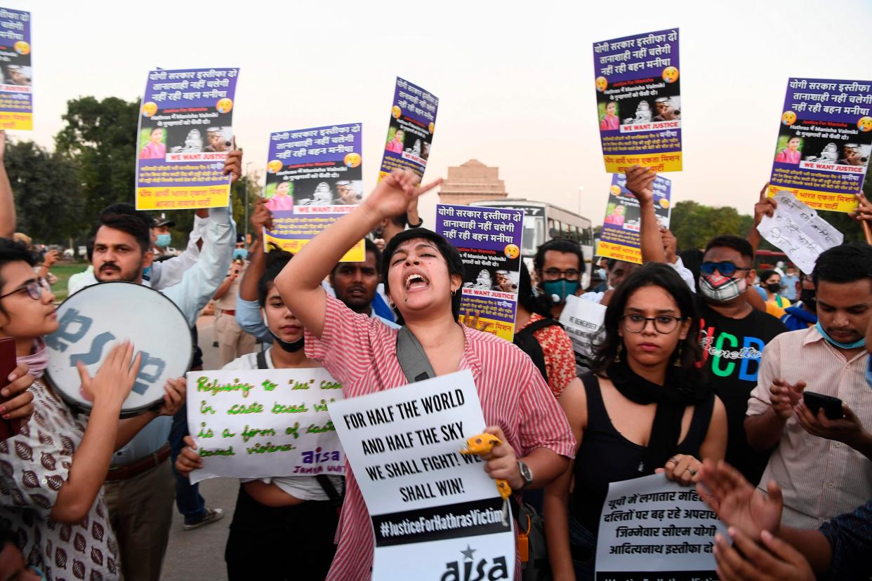 Demonstrators protest against Indian Police for allegedly cremating the body of a 19-year-old woman victim (AFP via Getty Images)