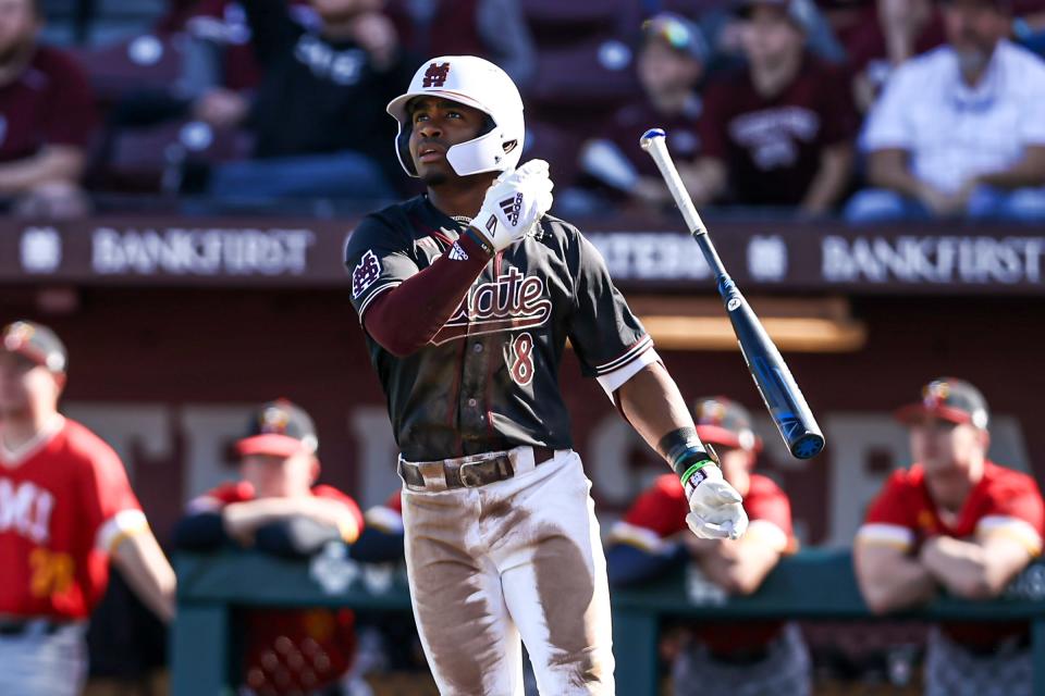 Mississippi State baseball infielder Amani Larry celebrates a home run against Virginia Military Institute on Feb. 19, 2023.