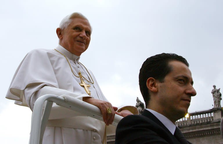 Pope Benedict XVI's at the time butler Paolo Gabriele October 10, 2006 arriving with the pontiff during a weekly general audience at St Peter's square. Pope Benedict XVI on Saturday pardoned his former butler Paolo Gabriele, who was sentenced to 18 months in jail for leaking secret papal memos, but banished him from the Vatican