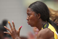 Shelly-Ann Fraser-Pryce, of Jamaica, runs in her heat of the women's 100-meters at the 2020 Summer Olympics, Friday, July 30, 2021, in Tokyo. (AP Photo/Matthias Schrader)