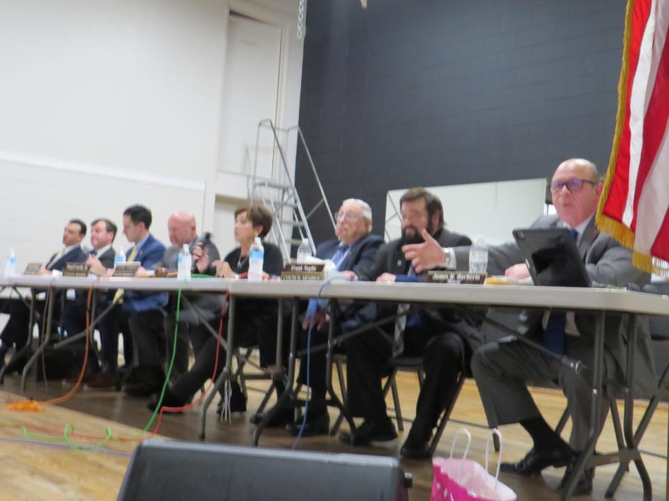 Parsippany Mayor James Barberio, right, and the Township Council plead for calm during a seven-hour council meeting on Thursday at the Parsippany PAL Building attended by about 800 mostly angry residents.