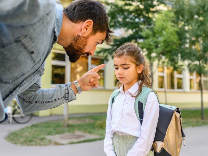 A dad yelling at a child while they're at school