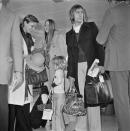 <p>Charlie Watts of rock group the Rolling Stones at Heathrow Airport in London with his wife Shirley (left) and their daughter Seraphina, UK, 5th December 1972.</p>