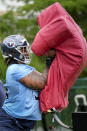 Tennessee Titans first round draft pick offensive tackle JC Latham runs though drills during an NFL rookie minicamp football practice Friday, May 10, 2024, in Nashville, Tenn. (AP Photo/George Walker IV)
