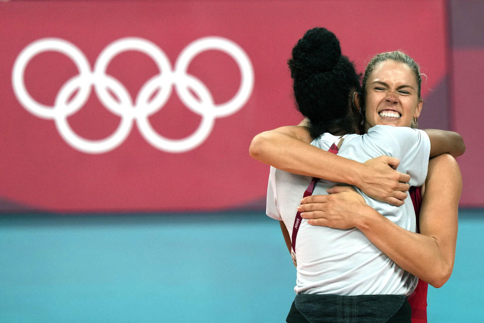 United States' Andrea Drews, rear, and United States' Jordan Thompson celebrate winning the women's volleyball preliminary round pool B match between United States and Italy at the 2020 Summer Olympics, Monday, Aug. 2, 2021, in Tokyo, Japan. (AP Photo/Frank Augstein)
