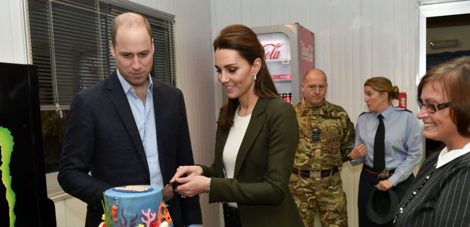 Catherine, Duchess of Cambridge and Prince William, Duke of Cambridge cut a cake as they open the Oasis centre which is used by Serving personnel on the base as a recreation area at the Akrotiri Royal Air Force base during an official visit on December 5, 2018 in Akrotiri, Cyprus.