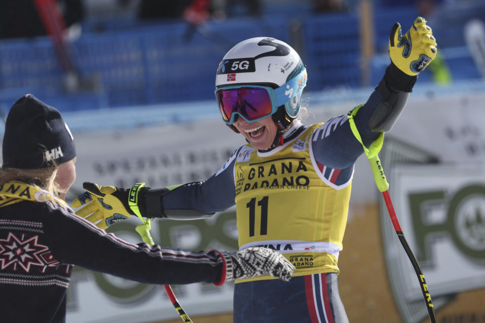 Norway's Ragnhild Mowinckel celebrates after completing an alpine ski, women's World Cup super-G, in Cortina d'Ampezzo, Italy, Sunday, Jan. 22, 2023. (AP Photo/Alessandro Trovati)