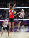 LONDON, ENGLAND - JULY 30: Mariusz Prudel of Poland blocks against Jacob Gibb of the United States during the Men's Beach Volleyball Preliminary match between United States and Poland on Day 3 of the London 2012 Olympic Games at Horse Guards Parade on July 30, 2012 in London, England. (Photo by Ryan Pierse/Getty Images)