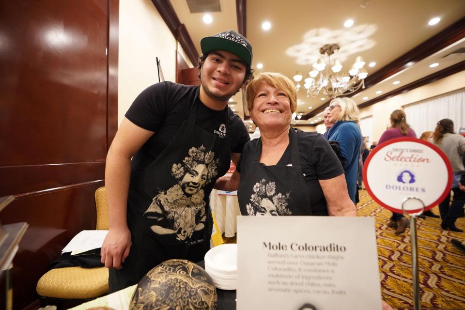 That's the team from Providence's Dolores restaurant with matriarch and chef Maria Meza, right, serving her Mole Coloradito at The Providence Journal's Critic's Choice in 2022.
