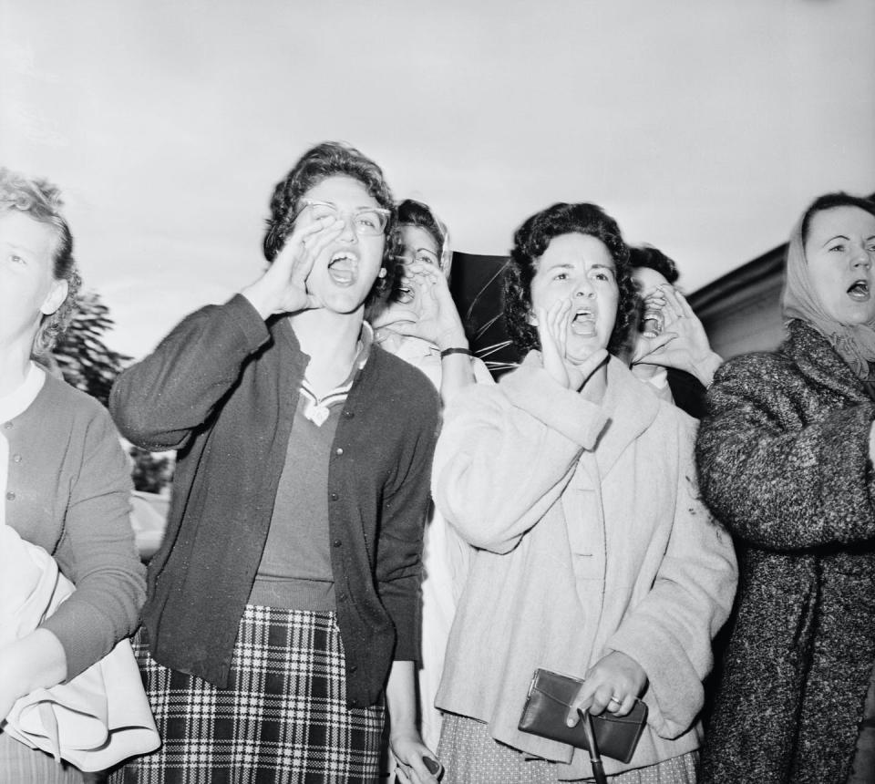 <span class="caption">White mothers scream at three 6-year-old girls entering McDonogh 19 Elementary School on Nov. 18, 1960.</span> <span class="attribution"><a class="link " href="https://www.gettyimages.com/detail/news-photo/at-mcdough-elementary-in-new-orleans-louisiana-mothers-of-news-photo/514907048?adppopup=true" rel="nofollow noopener" target="_blank" data-ylk="slk:Bettmann/GettyImages;elm:context_link;itc:0;sec:content-canvas">Bettmann/GettyImages</a></span>