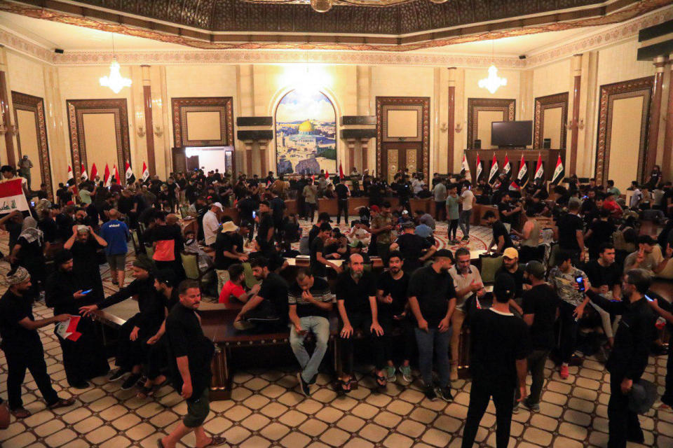 Supporters of Iraqi cleric Muqtada al-Sadr storm the Presidential Palace in the Green Zone, after al-Sadr announced his total withdrawal from politics in Baqhdad, Iraq, August 29, 2022. / Credit: Murtadha Al-Sudani/Anadolu Agency/Getty