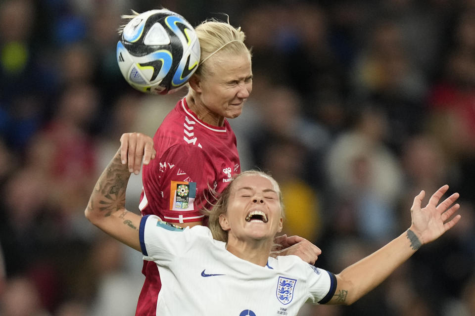 Denmark's Pernille Harder gets above England's Rachel Daly to win a header during the Women's World Cup Group D soccer match between England and Denmark at the Sydney Football Stadium in Sydney, Australia, Friday, July 28, 2023. (AP Photo/Rick Rycroft)