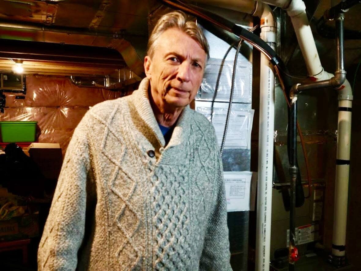 Retiree William Lobodici's new home in Hamilton had everything he and his wife wanted, except proper heating and cooling — the furnace and air conditioner installed in the townhouse were initially too small.  (Robert Krbavac/CBC - image credit)