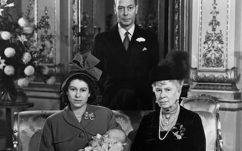 King George VI and great grandmother, Queen Mary, with Prince Charles - Credit: Hulton Deutsch/Getty Images