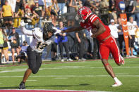 Louisiana-Lafayette wide receiver Michael Jefferson, right, cores a touchdown against Appalachian State defensive back Madison Cone (12) during the first half of the Sun Belt Conference championship NCAA college football game in Lafayette, La., Saturday, Dec. 4, 2021. (AP Photo/Matthew Hinton)