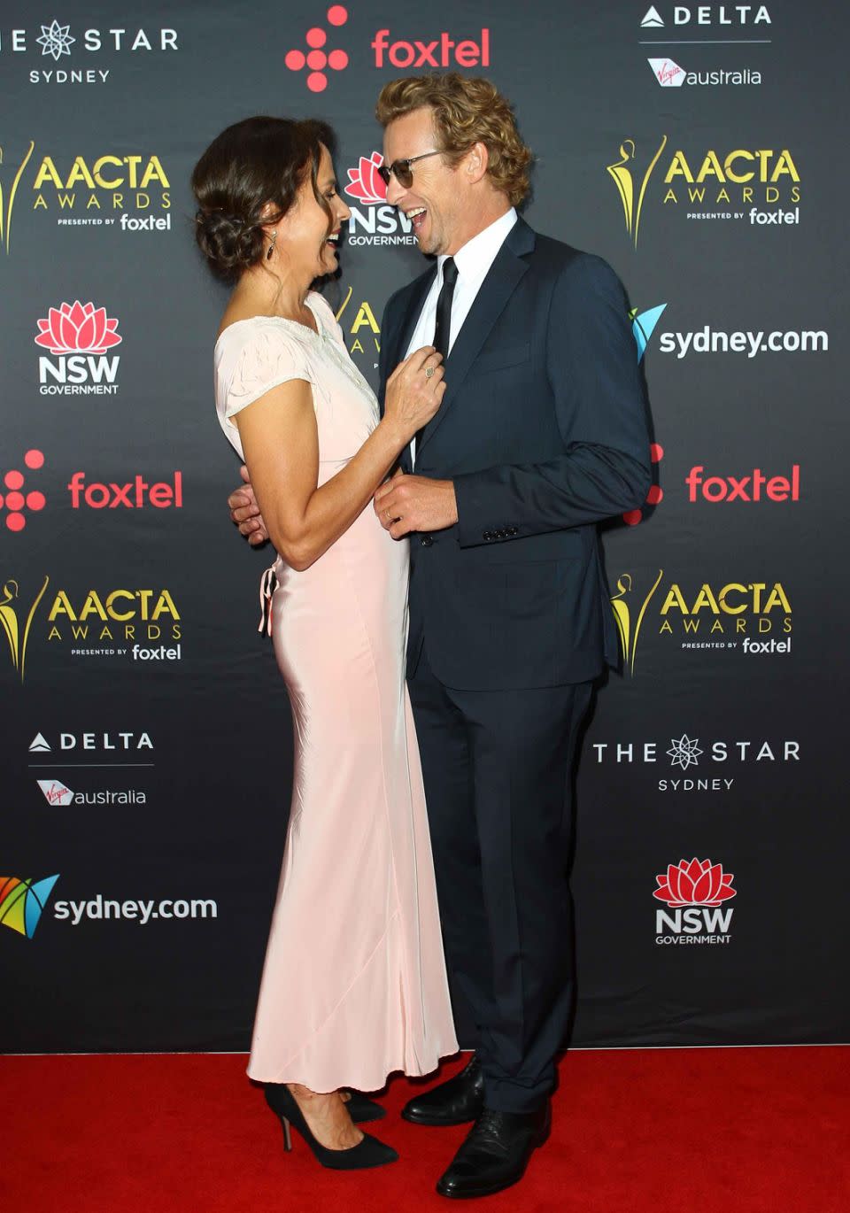 Simon Baker and his wife Rebecca Rigg looked loved-up on the red carpet. Source: Getty