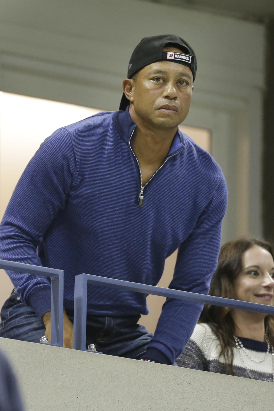 Golfer Tiger Woods watches a match between Rafael Nadal, of Spain, and Marin Cilic, of Croatia, during the fourth round of the U.S. Open tennis tournament, Monday, Sept. 2, 2019, in New York. (AP Photo/Seth Wenig)