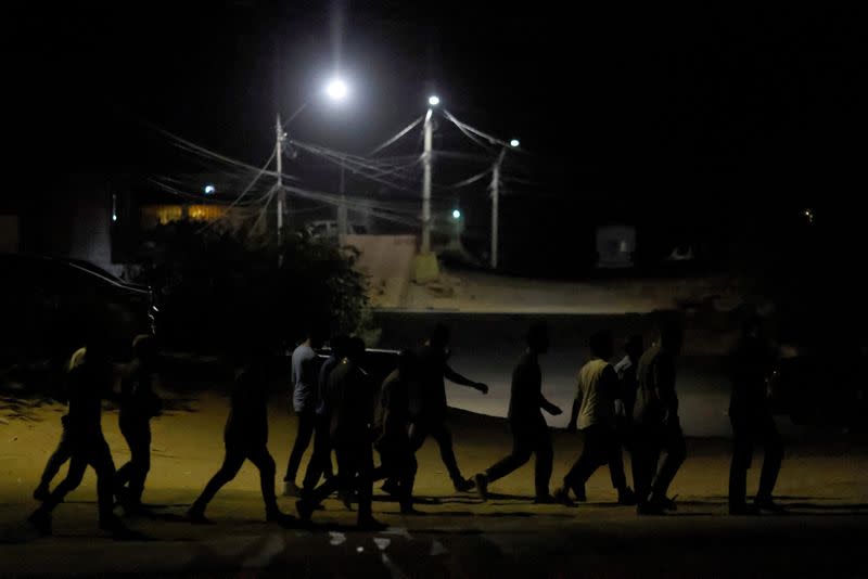 FILE PHOTO: Migrants expelled from the United States to Mexico under Title 42 walk in Ciudad Juarez