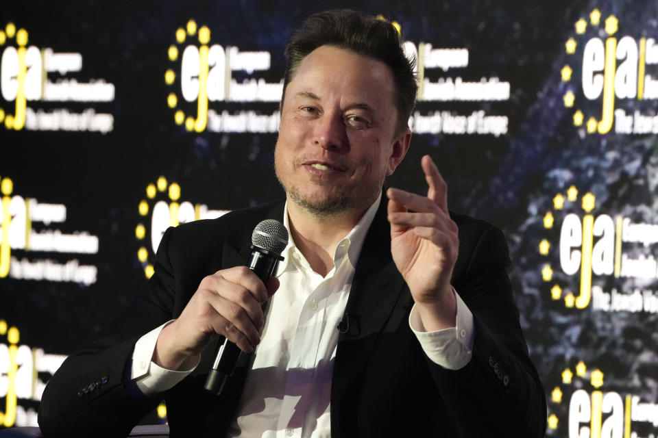 Tesla and SpaceX's CEO Elon Musk gestures during an interview with Ben Shapiro at the European Jewish Association's conference, in Krakow, Poland, Monday, Jan. 22, 2024. Musk visited earlier in the day the site of the Auschwitz-Birkenau Nazi German death camp in Oswiecim, Poland, the private visit apparently took place in response to calls from some Jewish religious leaders for Musk to see with his own eyes the most symbolic site of the horrors of the Holocaust. (AP Photo/Czarek Sokolowski)