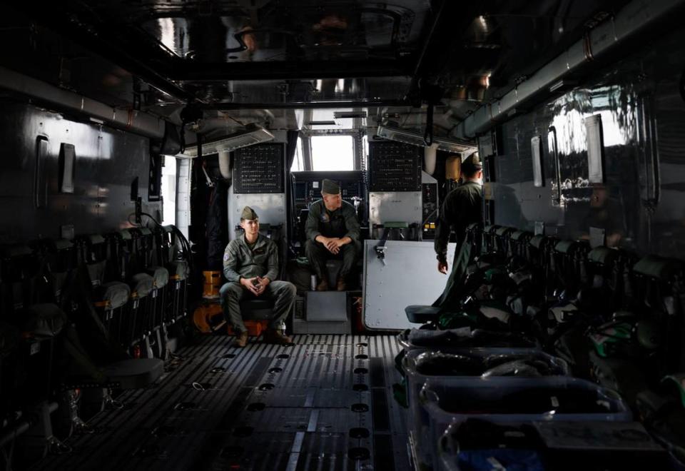 Members of a heavy marine helicopter squadron wait for people to view the CH-53K super stallion helicopter during the opening day of Fleet Week on the flight deck of the USS Bataan (LHD-5) on Monday, May 6, 2024, at Norwegian Cruise Lines Terminal in PortMiami. Alie Skowronski/askowronski@miamiherald.com