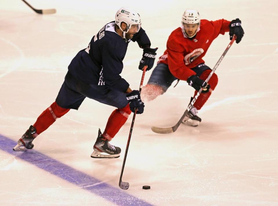 Florida Panther Aaron Ekblad (5) and Vinnie Hinostroza (13) during a power play drill at the BB&T Center in Sunrise, Florida, Wednesday, January 6, 2021.